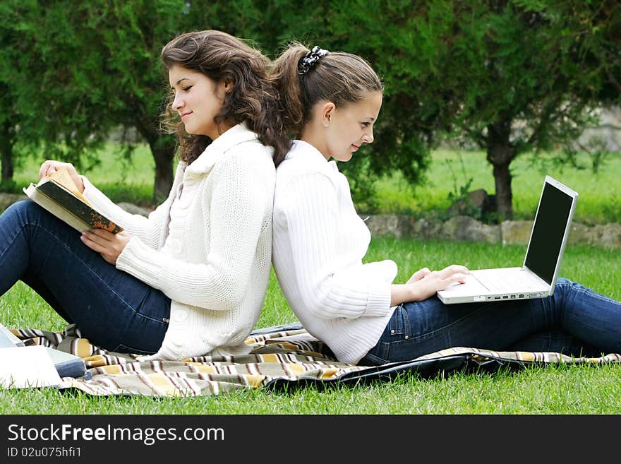 Two student girls on natural background. Two student girls on natural background