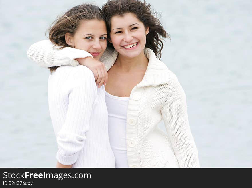 Two Young Happy Girls On Nature