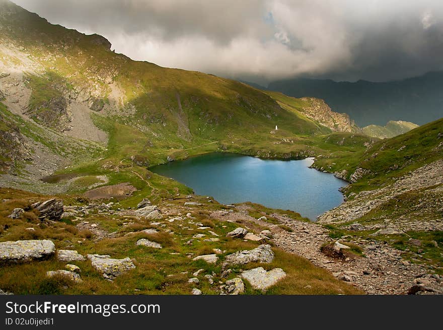 The alpine Goat Lake is situated in the southern Fagaras mountains, in Sibiu county, Romania . The alpine Goat Lake is situated in the southern Fagaras mountains, in Sibiu county, Romania