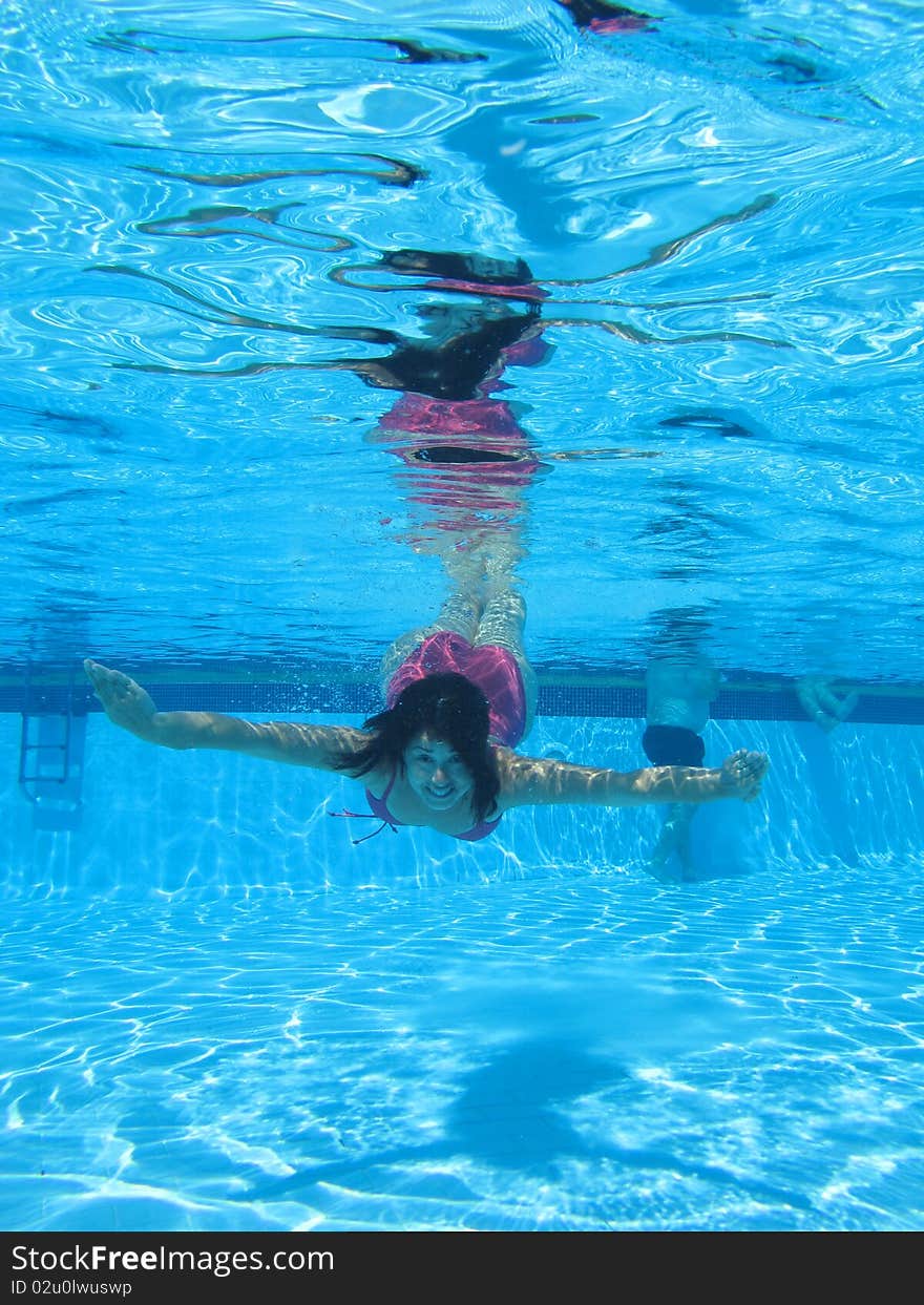 Swimming underwater photo of a women