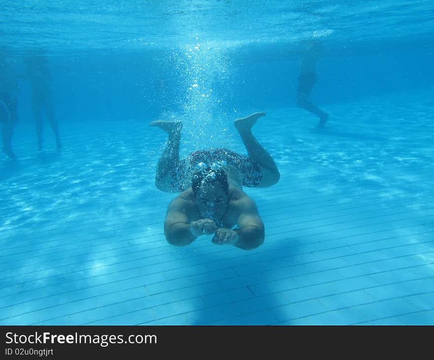 Swimming underwater photo of a men