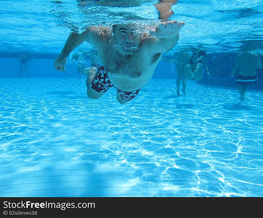 Swimming underwater photo of a men