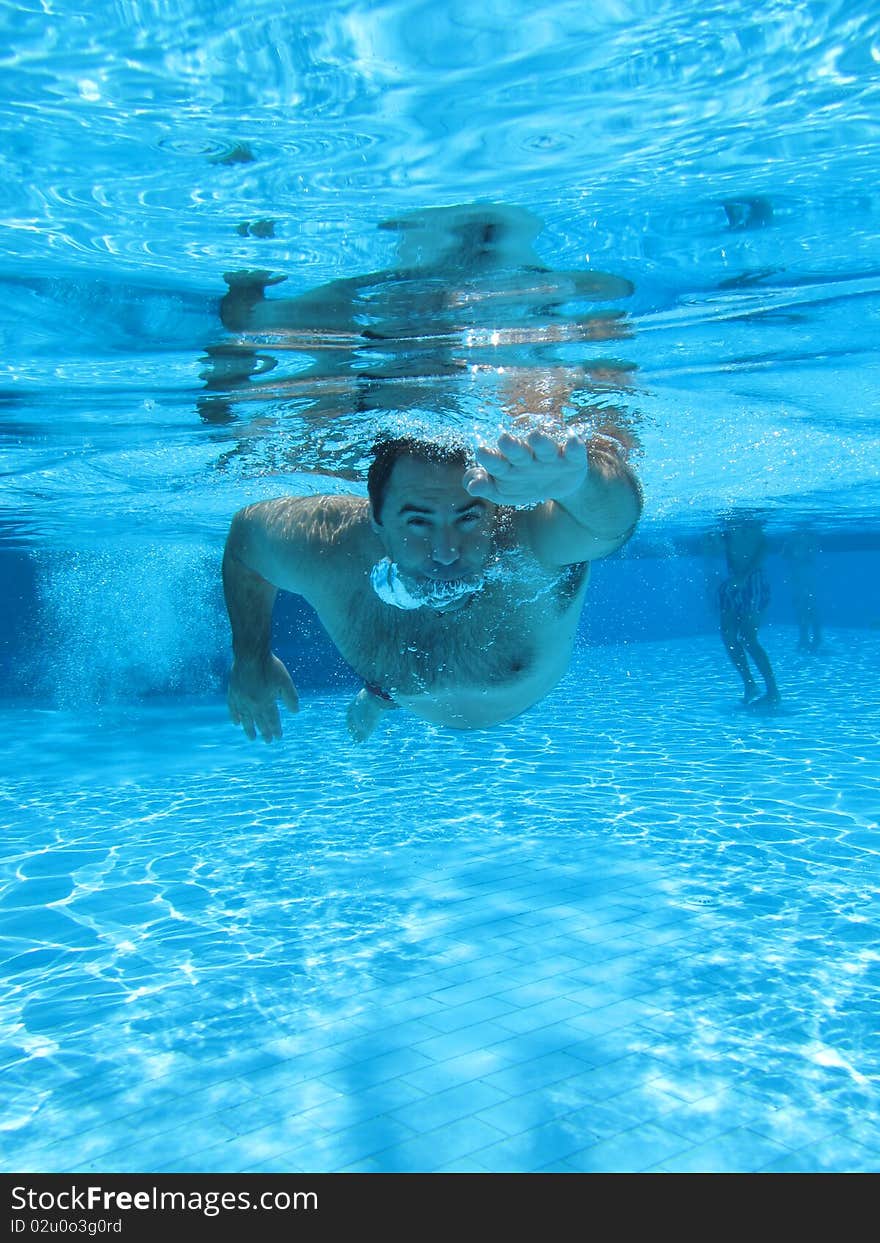 Swimming underwater photo of a men