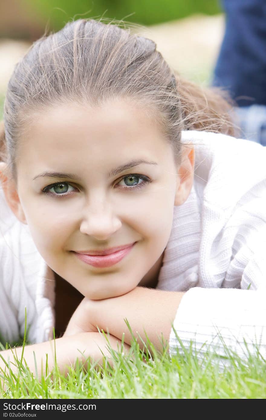 Portrait of young smiling girl on nature