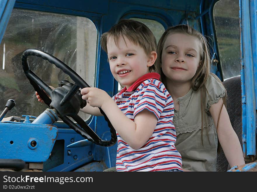 Brother and sister first time in tractor cab. Brother and sister first time in tractor cab.