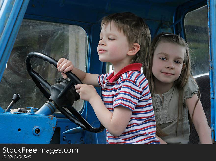 Brother and sister first time in tractor cab. Brother and sister first time in tractor cab.