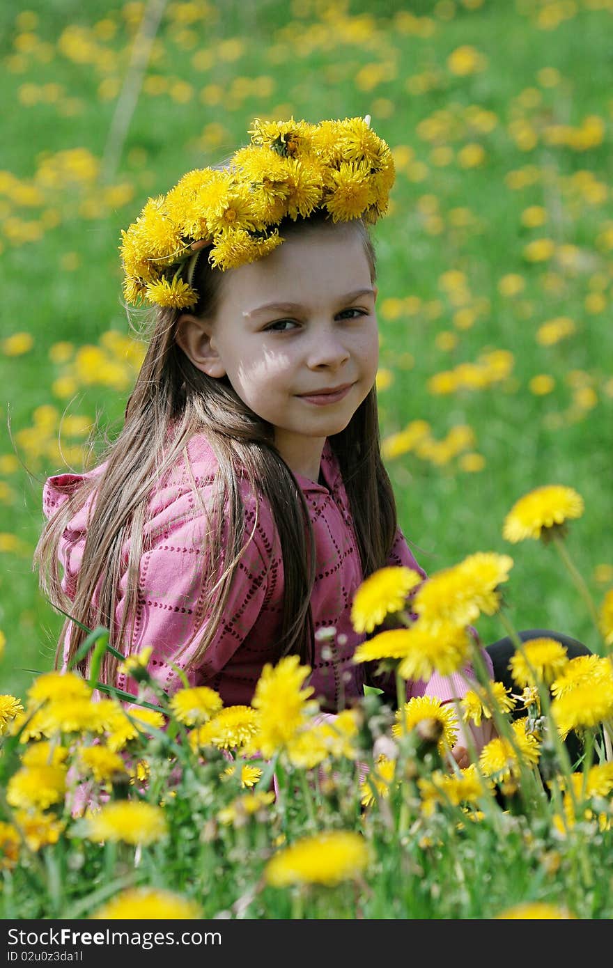 Nice, young girl enjoy summer time in the dandelion meadow. Nice, young girl enjoy summer time in the dandelion meadow.