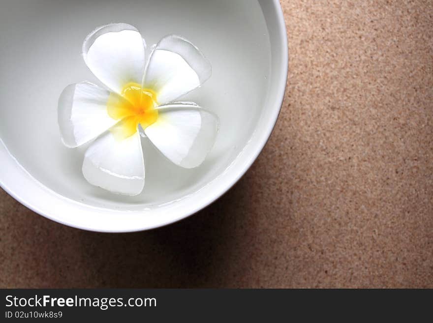 Aromatherapy bowl with frangipani flower in the perfumed water. Aromatherapy bowl with frangipani flower in the perfumed water