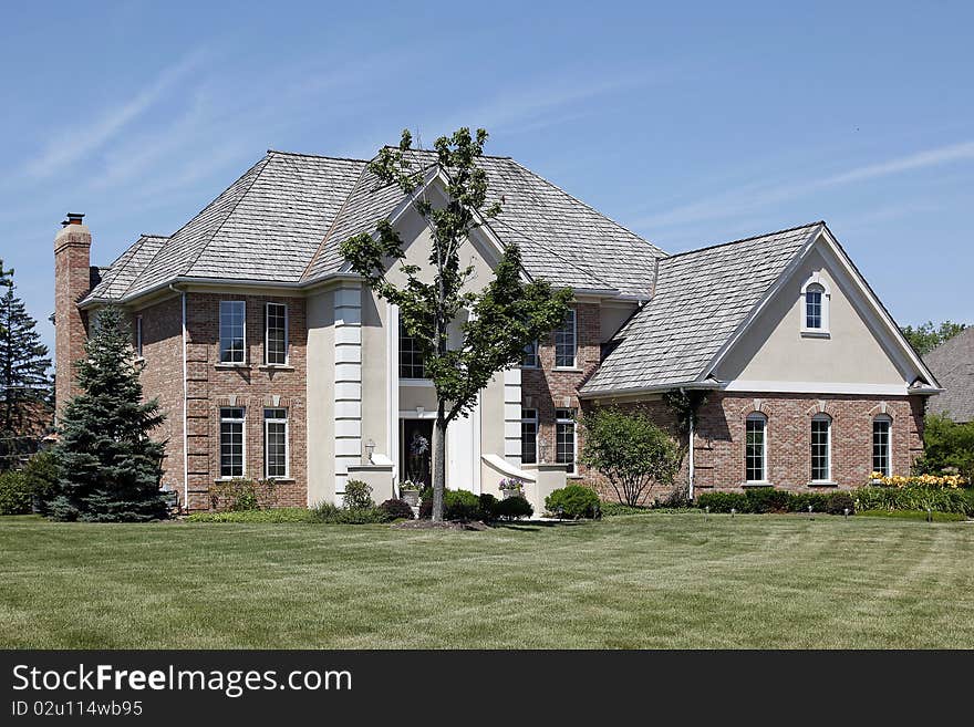 Large brick home with cedar shake roof. Large brick home with cedar shake roof