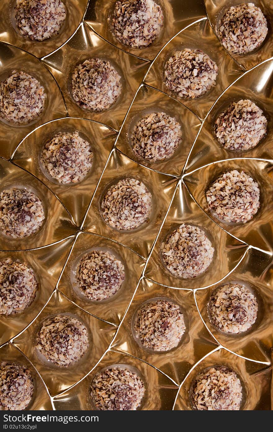 Chocolate sweets in packing from a golden foil