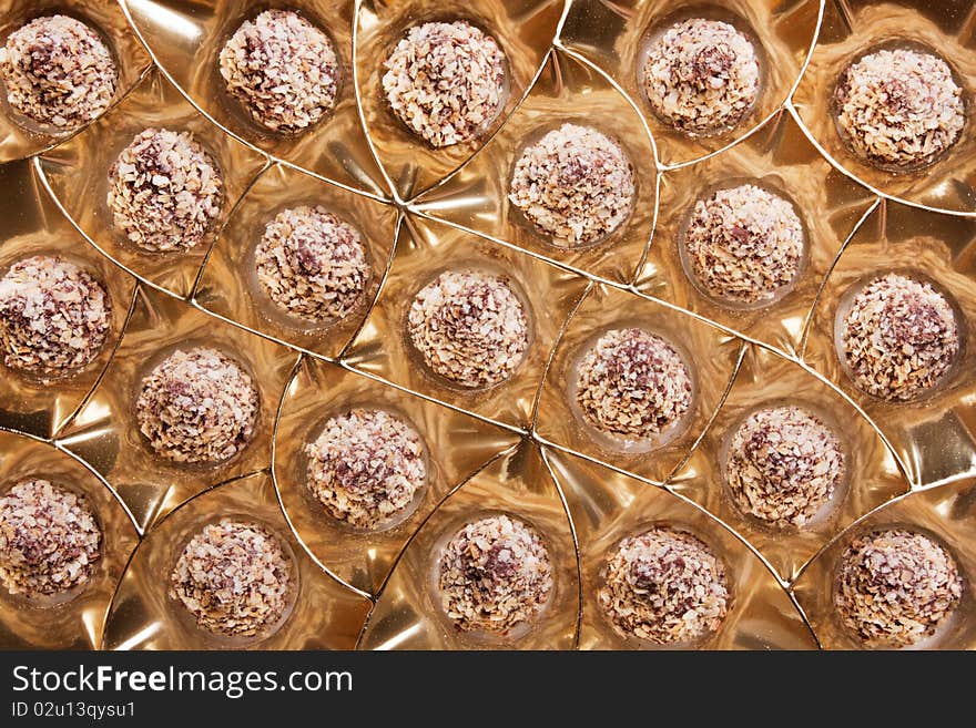 Chocolate sweets in packing from a golden foil