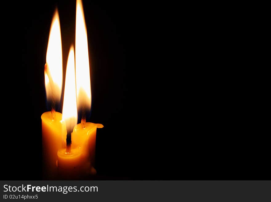 Candles on the black background. Candles on the black background