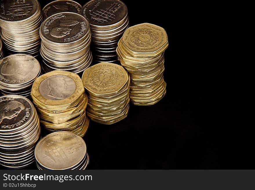 Coins on black background