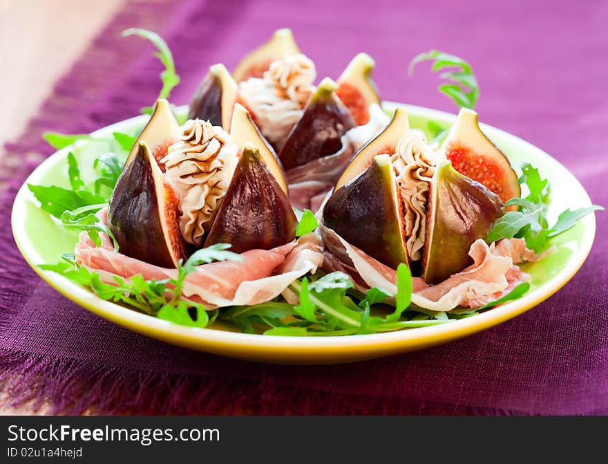 Salad with fresh figs, cheese,prosciutto,rocket  and balsamic. Salad with fresh figs, cheese,prosciutto,rocket  and balsamic