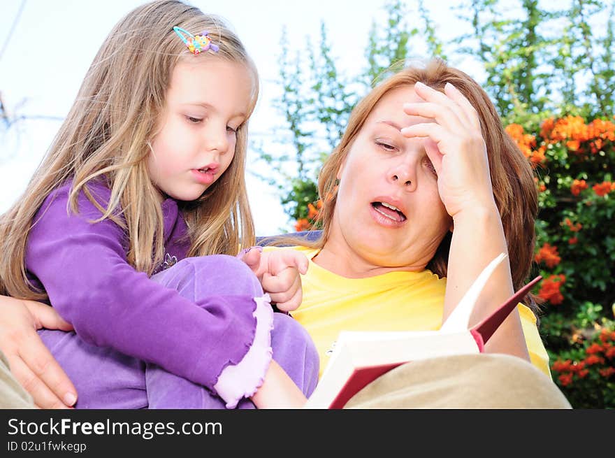 Mother and daughter reading a book