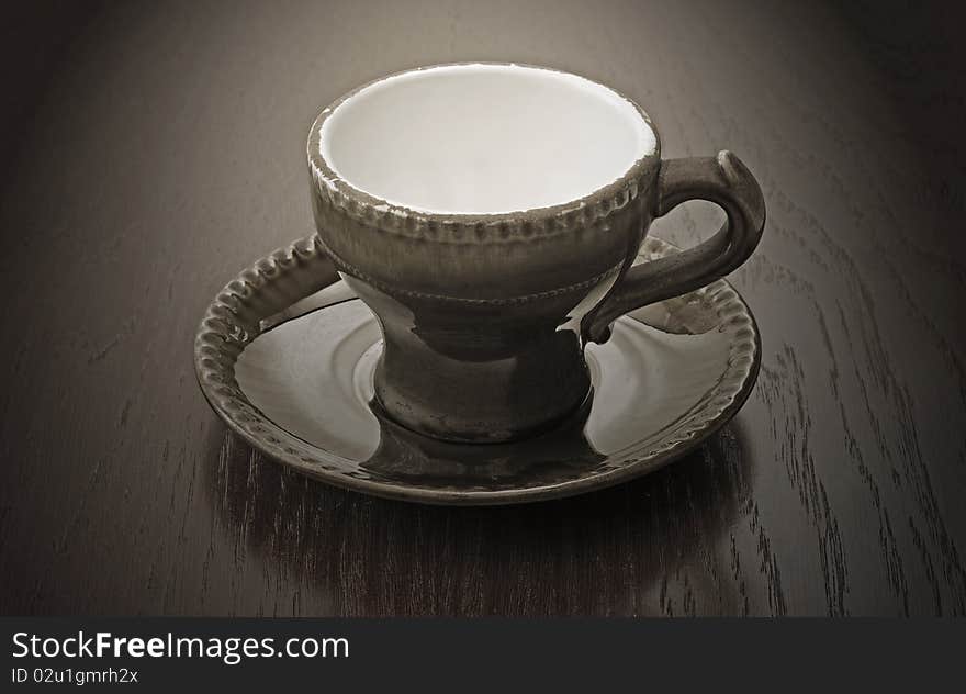 Vintage coffee cup on wooden table