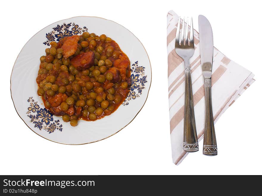 Cooked peas with bacon and carrots isolated on white background with clipping path. Cooked peas with bacon and carrots isolated on white background with clipping path