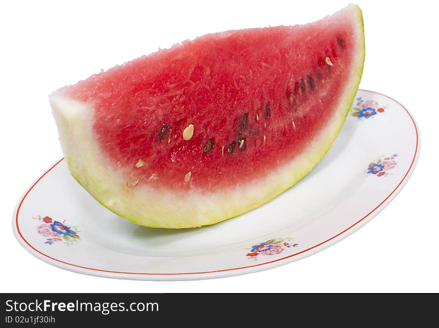 Watermelon on plate isolated on white with clipping path