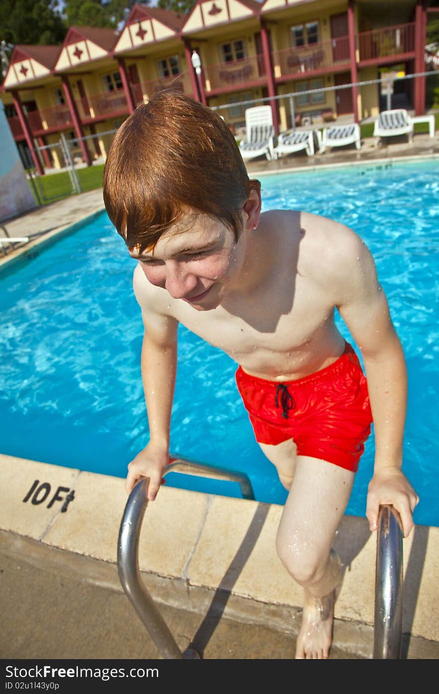 Child has fun in the outdoor pool. Child has fun in the outdoor pool