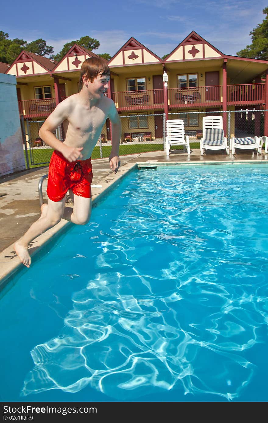 Child has fun jumpingt in the pool. Child has fun jumpingt in the pool