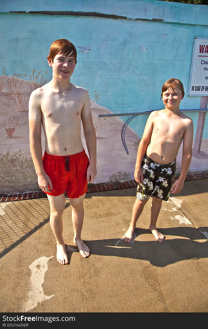 Two brothers having fun at the pool