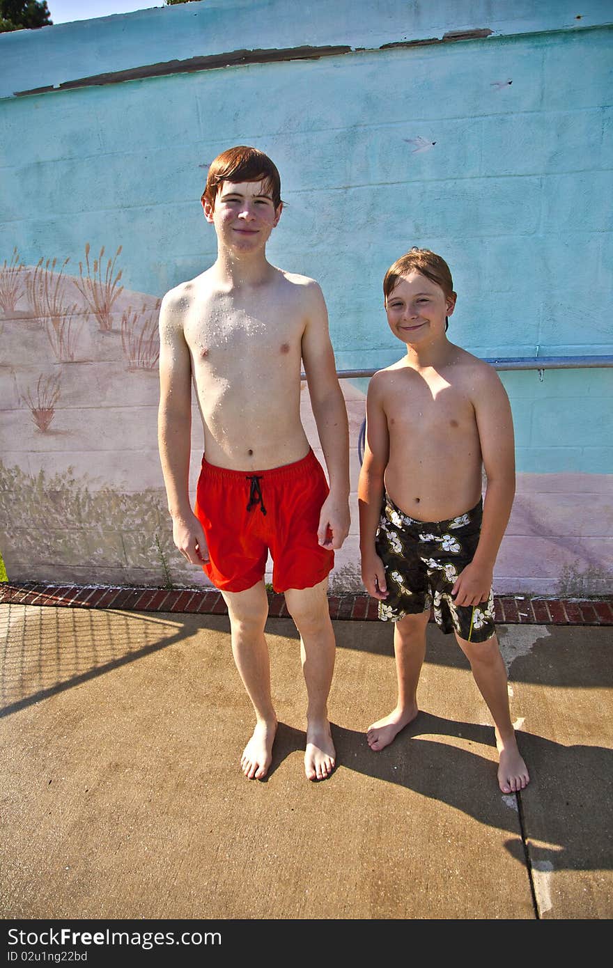 Two brothers having fun at the pool