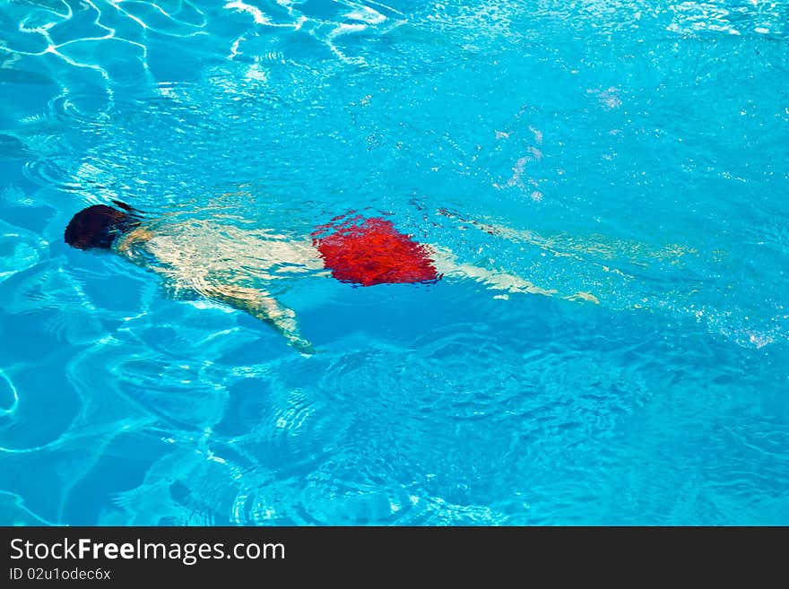 Child Has Fun In The Pool