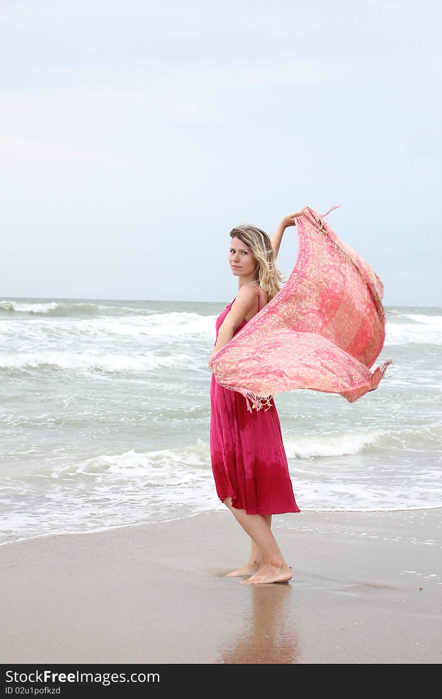 Woman standing near the sea. Woman standing near the sea