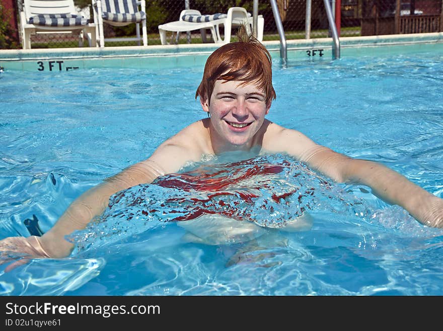 Young boy has fun in the pool. Young boy has fun in the pool