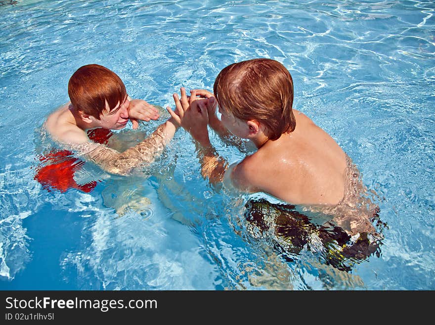 Child Has Fun In The Pool