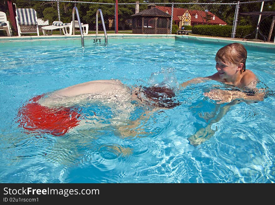 Child has fun in the pool