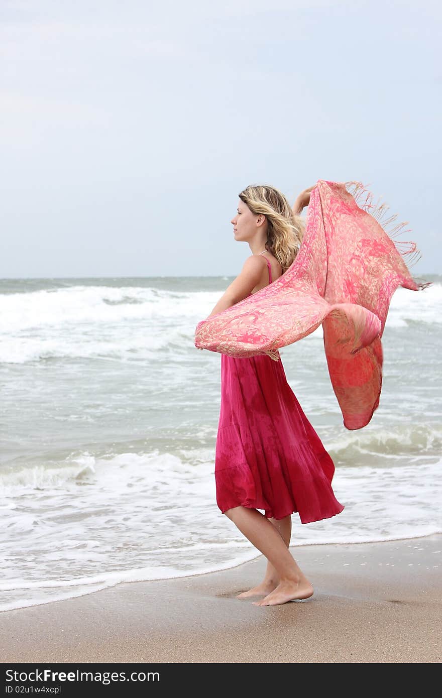 Woman standing near the sea. Woman standing near the sea