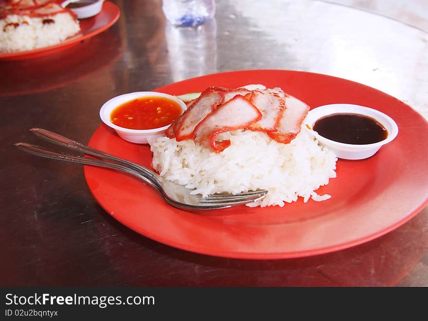 Chinese street food, Char siew rice as served at local restaurants all over Asia, in this case in Singapore.