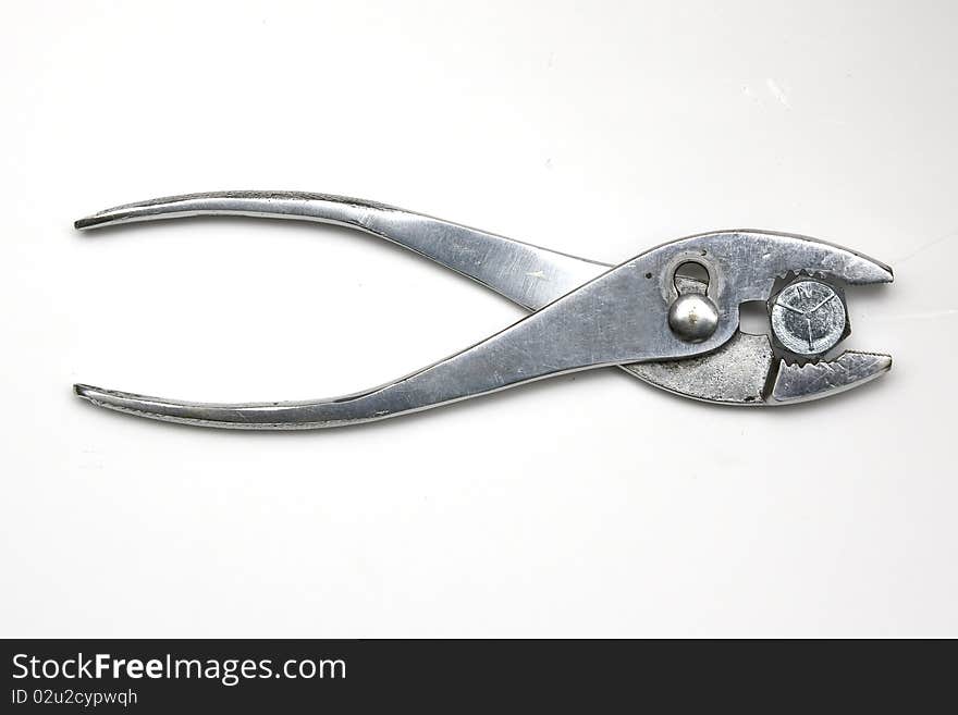 Pliers holding a bolt on white background