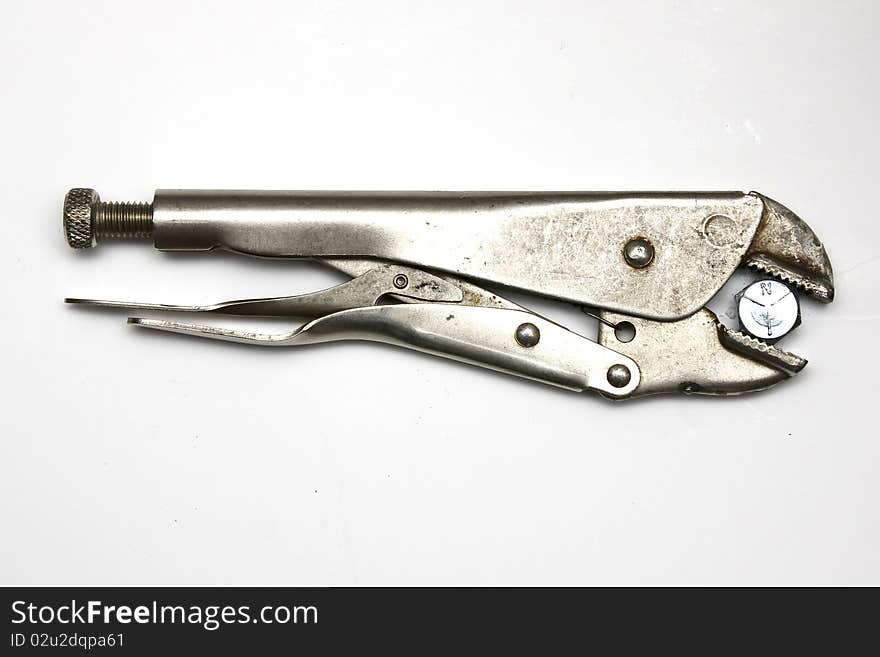 Pliers holding a bolt