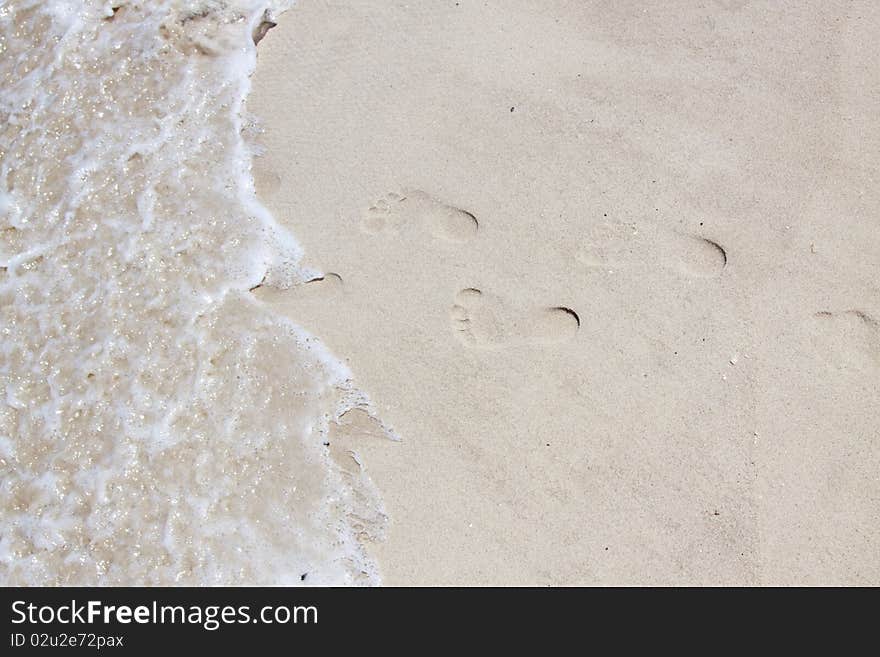 Feet marks on a ocean beach