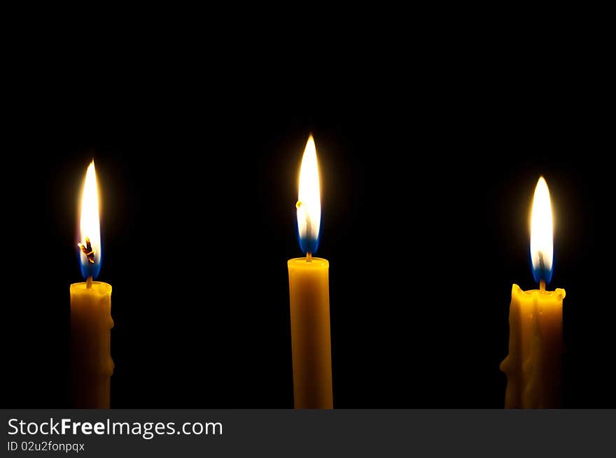 Candles isolated on black background