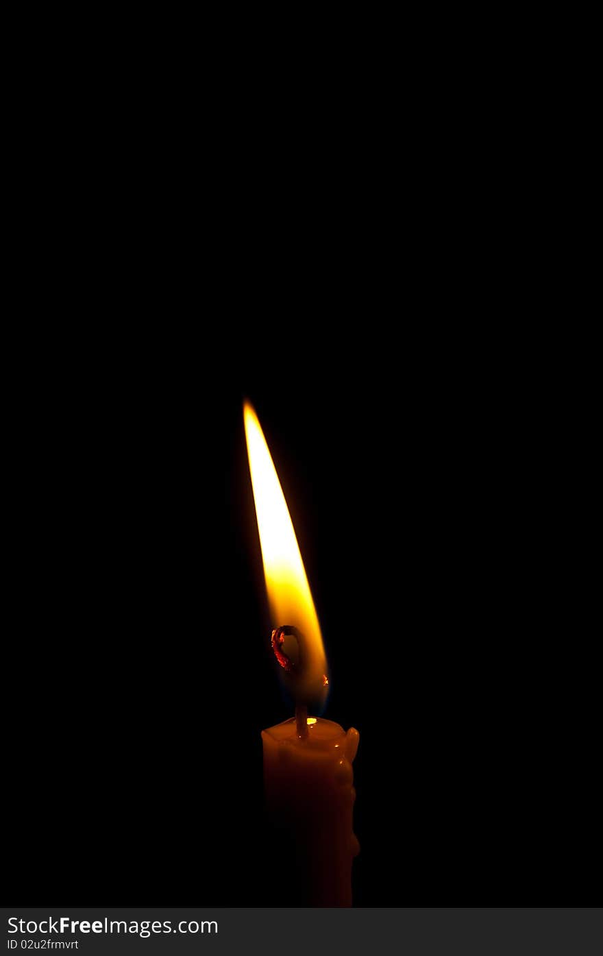 Candle isolated on black background