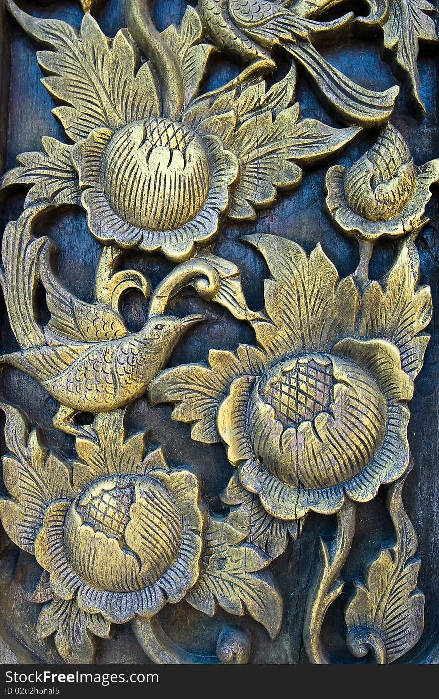 Folwer carved gold paint on church door