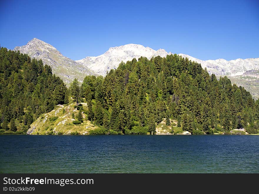 Alpine lake Cavloc Engadine in Switzerland