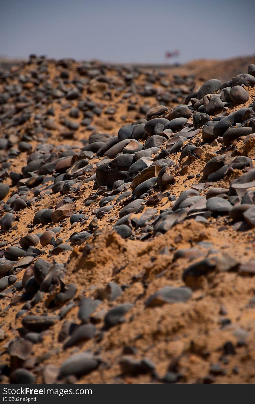 Desert rocks on yellow sand