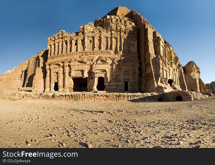 Facade of broken ancient amphitheater in Petra desert