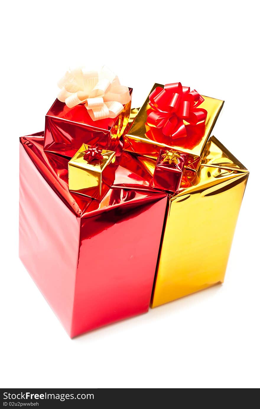 Red and yellow gifts boxes isolated on white background. Red and yellow gifts boxes isolated on white background