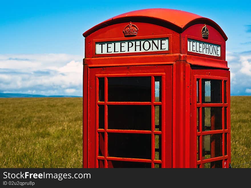 Red phone booth in landscape V4