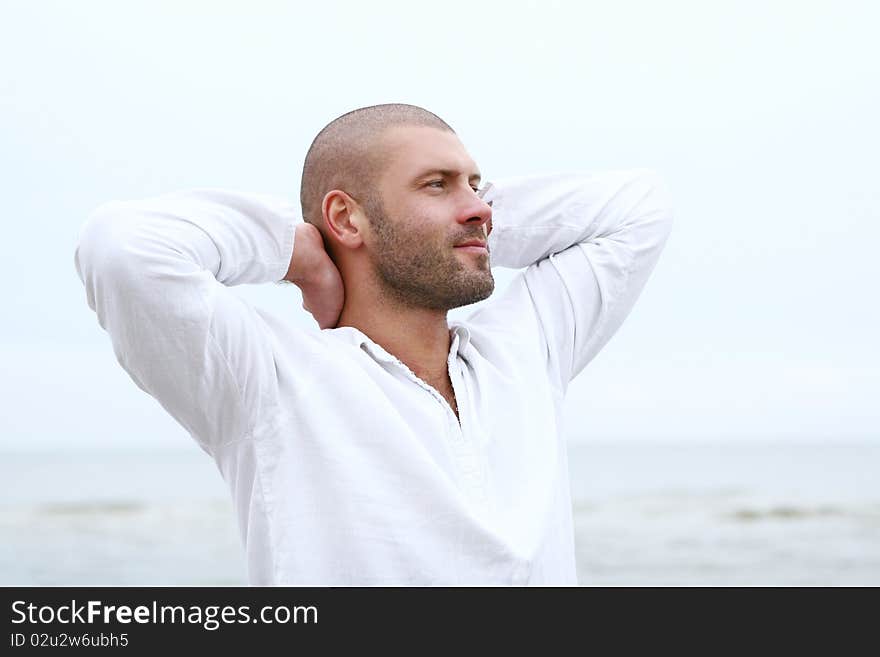 Attractive and happy man on beach