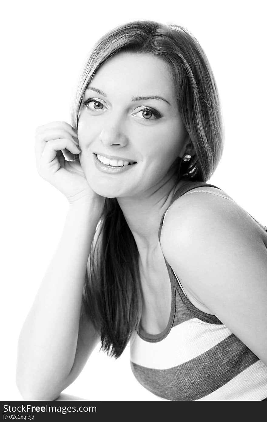 Closeup portrait of cute young girl smiling against white background