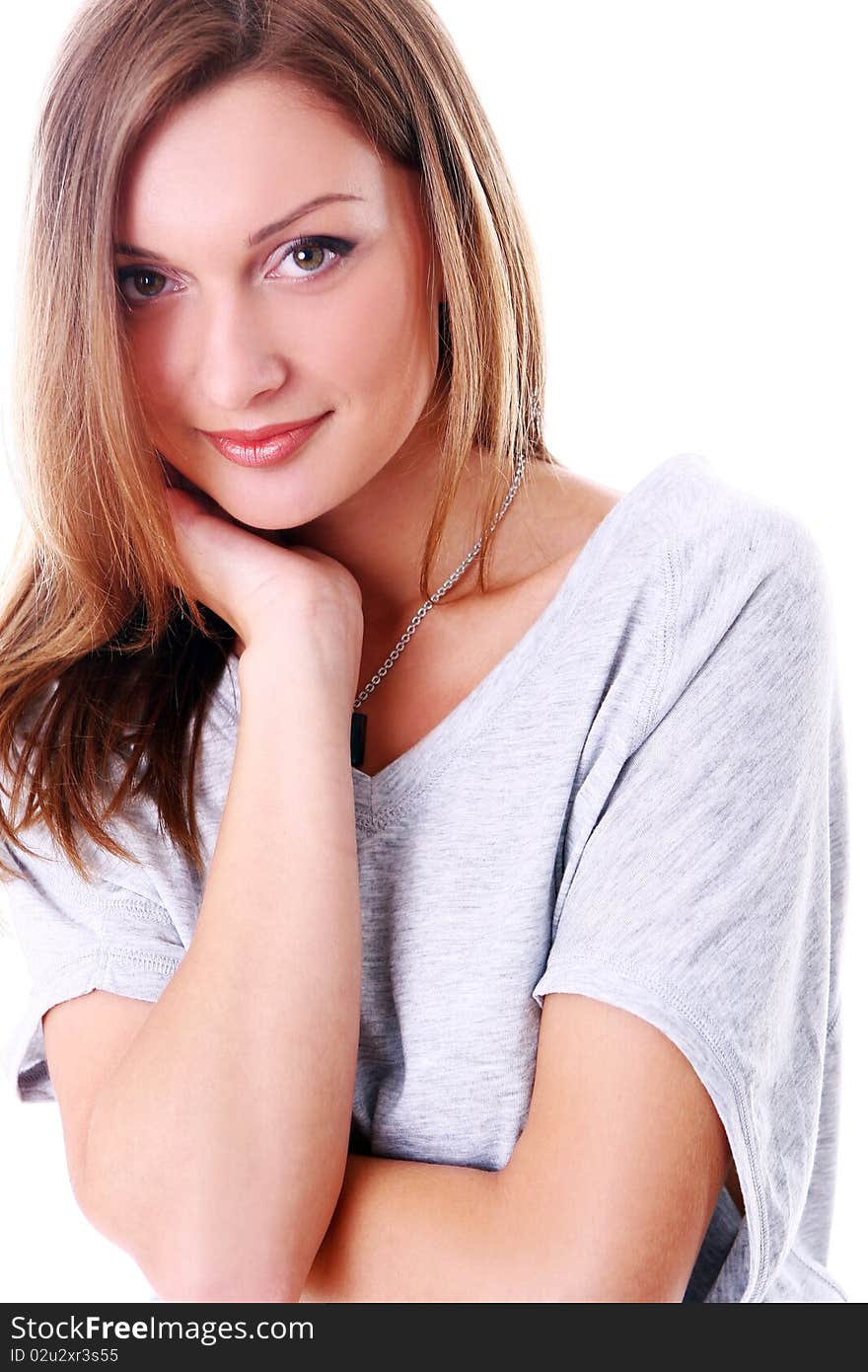 Closeup portrait of cute young girl smiling against white background