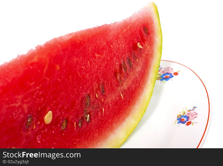 Watermelon on plate isolated on white. Watermelon on plate isolated on white