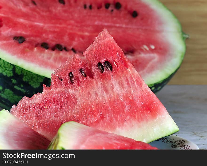 Red water-melon on a table. Red water-melon on a table.