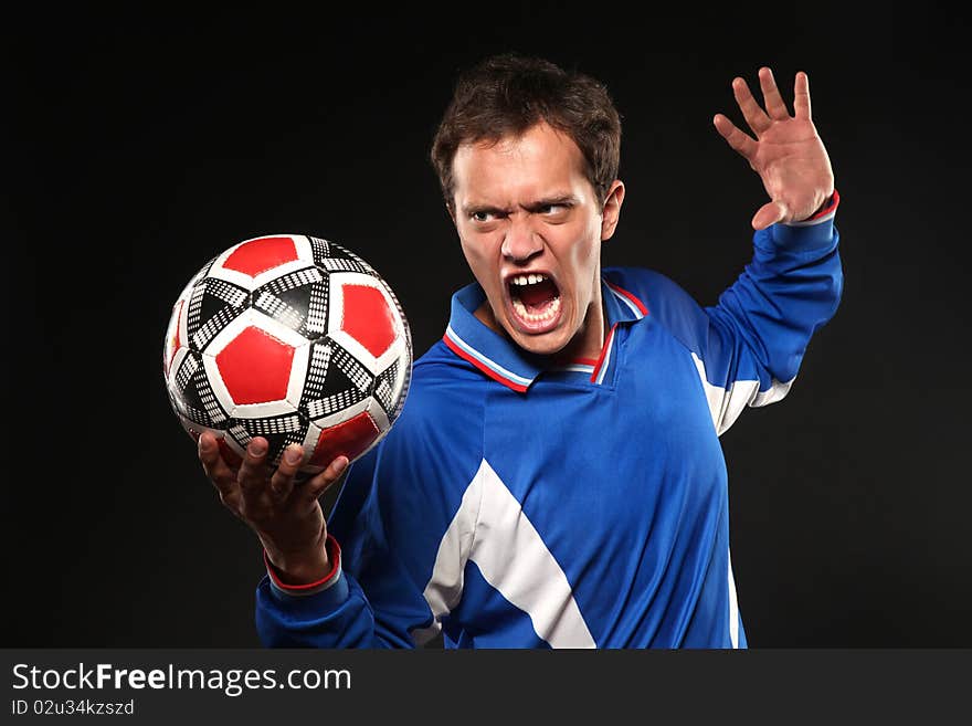 Football player screaming at ball